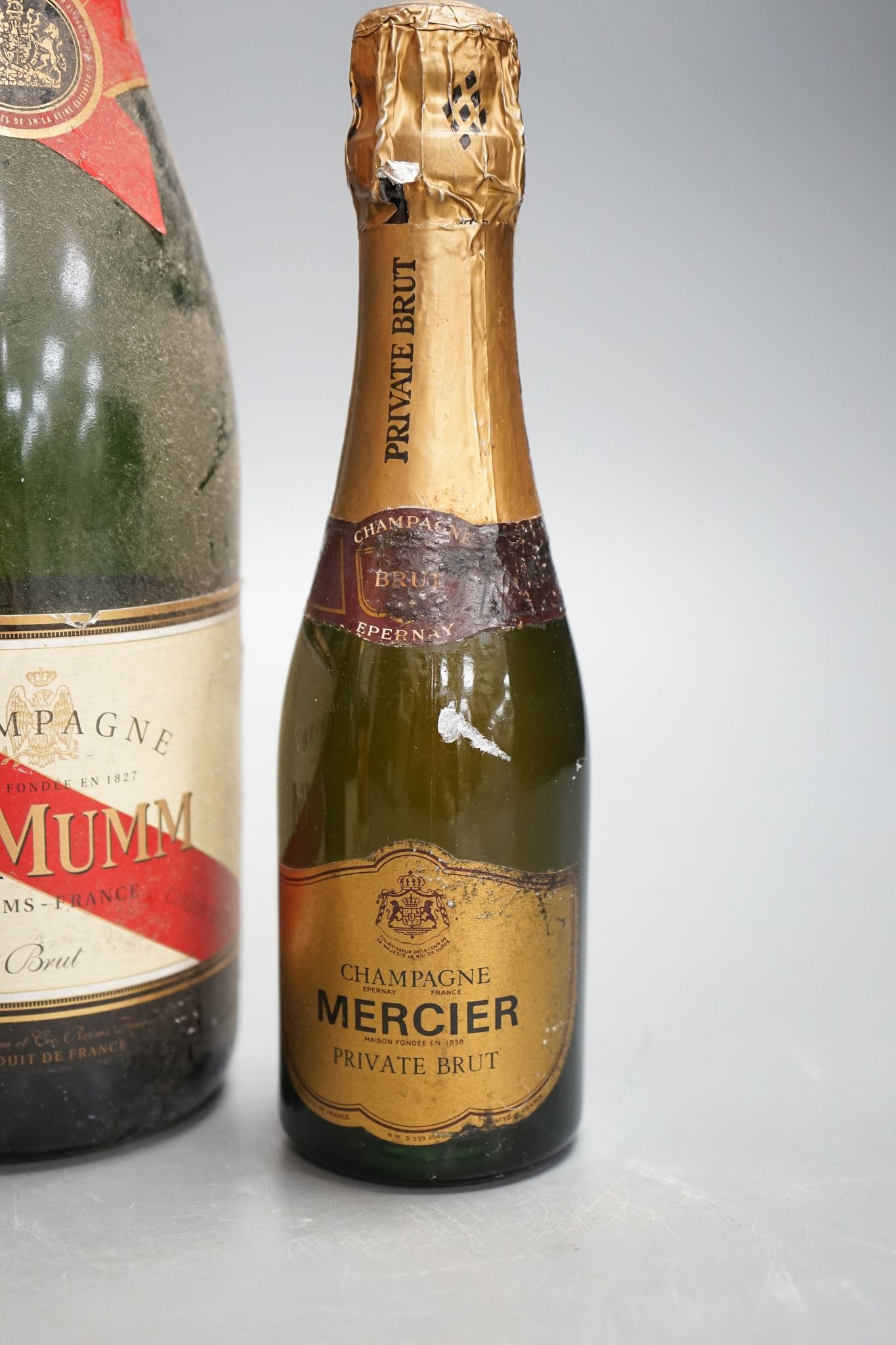 Two bottles of Mumm champagne and two small bottles of champagne